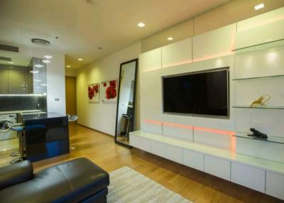 Modern living room interior with mounted television and comfortable seating