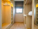 Spacious walk-in closet with built-in shelves and drawers