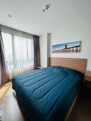 Modern bedroom with a large bed and wall art