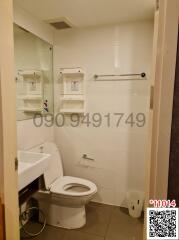 Compact bathroom interior with toilet and shower