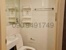 Compact bathroom interior with toilet and shower