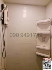 Compact bathroom with wall-mounted shelving and water heater