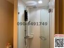 Modern bathroom with glass shower enclosure and wall-mounted water heater