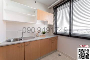 Modern kitchen with natural light and stainless steel sink