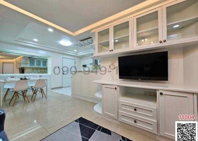 Spacious living room with built-in cabinets and modern design