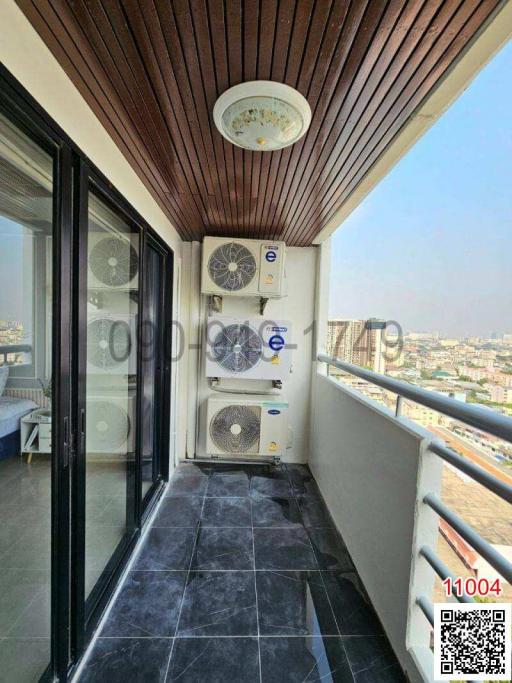 High-rise apartment balcony with wooden ceiling and city view