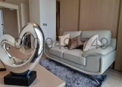 Modern living room interior with sofa and decorative heart sculpture