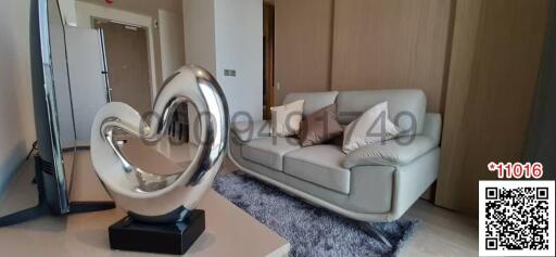 Modern living room interior with sofa and decorative heart sculpture