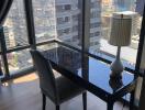 Modern high-rise apartment interior with a view of the cityscape through floor-to-ceiling windows