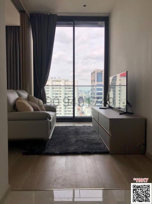 Cozy living room with city view through large window