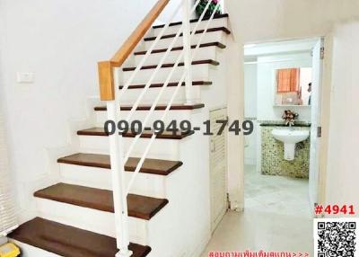 Interior staircase with access to a bathroom