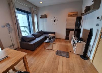 Cozy living room with modern furniture and balcony access