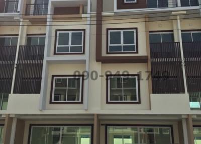 Modern multi-story residential building facade with balconies