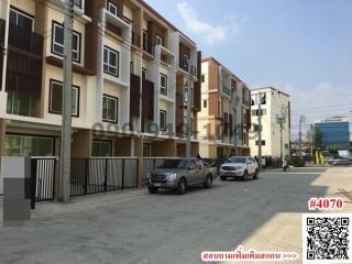 Exterior view of modern apartment building with parking space