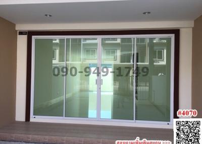 Sliding glass doors leading to the interior of a modern building