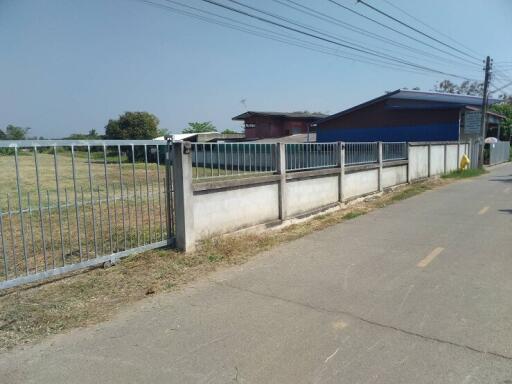 Exterior view of property with fence and field