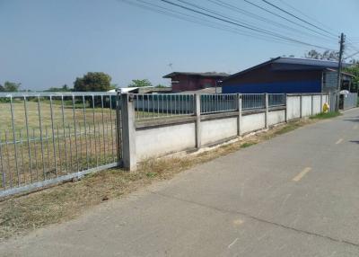 Exterior view of property with fence and field
