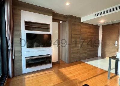 Modern living room interior with wooden finishes and large windows