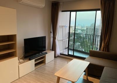 Cozy living room with modern furniture and balcony access