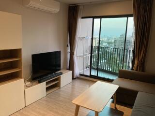 Cozy living room with modern furniture and balcony access