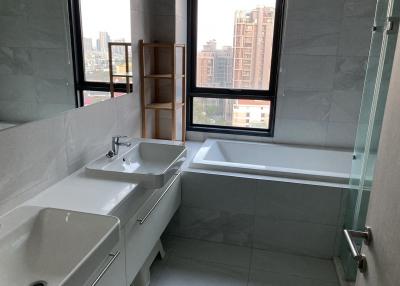 Modern bathroom with natural light and city view