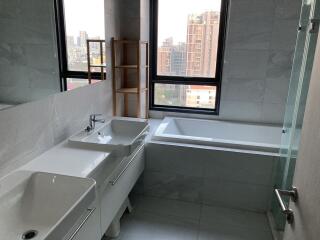 Modern bathroom with natural light and city view