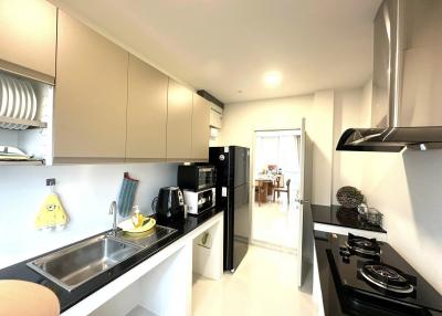 Modern kitchen with stainless steel appliances and ample storage space