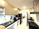 Modern kitchen with stainless steel appliances and ample storage space