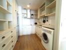 Modern kitchen with integrated appliances and wooden flooring