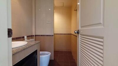 Modern bathroom interior with tiled walls and flooring