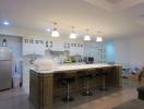 Spacious kitchen with modern island and bar stools