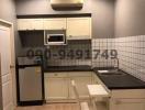 Compact modern kitchen with essential appliances