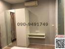 Compact bedroom with built-in wardrobe and air conditioning unit