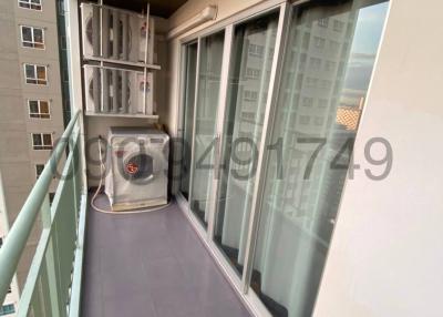 Spacious balcony with tile flooring and air conditioning unit