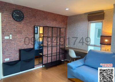 Elegant living room with brick accent wall and modern furnishings