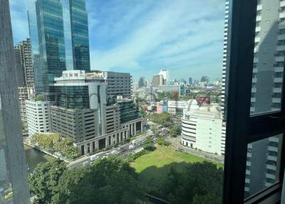 View from a high-rise building window overlooking urban landscape