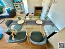 Modern dining area with glass table and comfortable seating