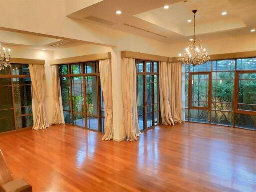 Spacious living room with hardwood floors and ample natural light