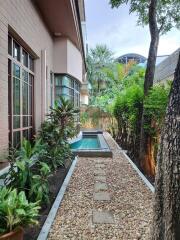 Cozy backyard with a swimming pool and lush greenery