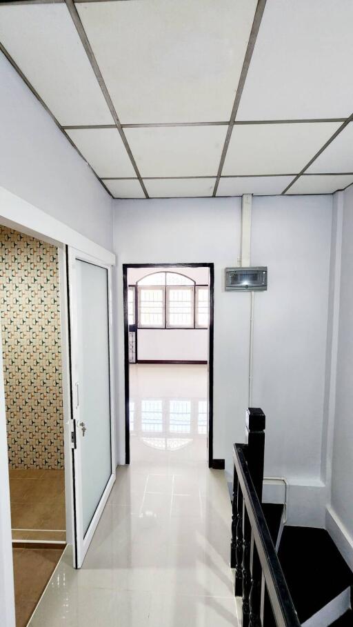 Bright and spacious corridor with tiled flooring in a modern home