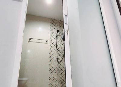 Modern bathroom with glass shower door and white interior
