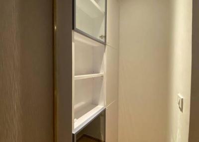 Built-in wooden closet with shelves in a home