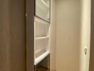 Built-in wooden closet with shelves in a home