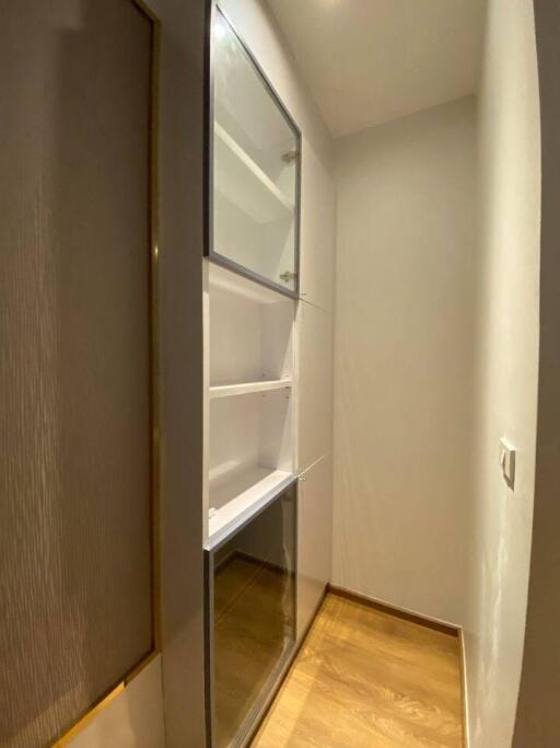 Built-in wooden closet with shelves in a home