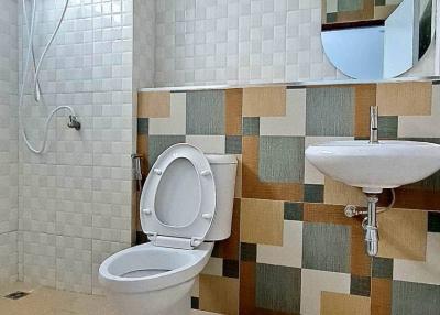 Modern bathroom with tiled walls and floor