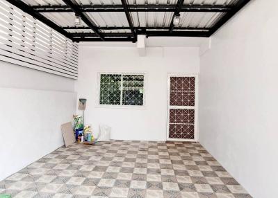 Spacious and clean tiled garage with natural light