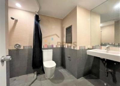 Modern bathroom with walk-in shower and large mirror