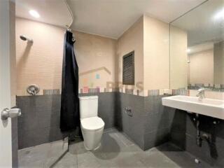 Modern bathroom with walk-in shower and large mirror