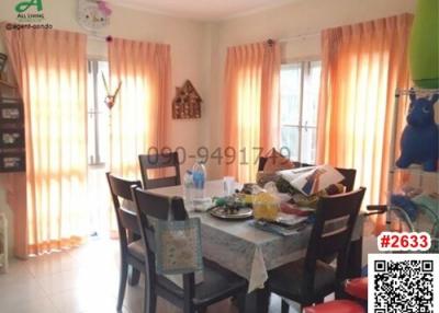 Bright dining room with large window and table set for a meal