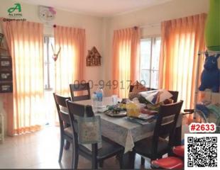 Bright dining room with large window and table set for a meal